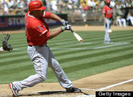 Vernon Wells of the Los Angeles Angels of Anaheim hits an RBI single driving in Erick Aybar #2 (not pictured) in the second inning against the Oakland Athletics at O.co Coliseum on September 3, 2012 in Oakland, California. (Photo by Thearon W. Henderson/Getty Images)