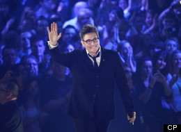 k.d. lang waves to the crowd after receiving a Juno for her Canadian Music Hall of Fame induction during the 2013 Juno Awards in Regina on Sunday, April 21, 2013. (THE CANADIAN PRESS/Liam Richards)