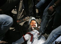 Indian Tamil activists and supporters stomp on a portrait of Sri Lankan President Mahinda Rajapaksa during a protest against Sri Lanka’s alleged wartime abuses in Chennai, India, Thursday, March 21, 2013. (AP Photo/Arun Sankar K.)