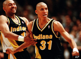Indiana Pacers guards Reggie Miller (31) and Mark Jackson taunt New York film director and avid Knicks fan Spike Lee.