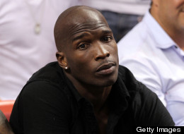 Chad 'Ochocinco' Johnson watches the Miami Heat play against the Chicago Bulls in Game Four of the Eastern Conference Finals during the 2011 NBA Playoffs on May 24, 2011 at American Airlines Arena in Miami, Florida.