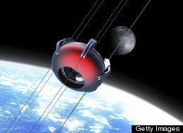 Illustration of a futuristic space elevator rising into orbit with the moon in background. The space elevator uses a carbon nanotube ribbon that stretches from the surface of the earth to a counterweight in space.