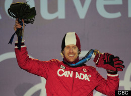 Jon Montgomery shows off his gold medal at the 2010 Vancouver Winter Games.