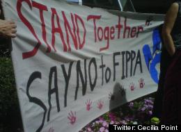 Members of the Hupacasath First Nation protest a Canada-China treaty in Vancouver. (<a href=
