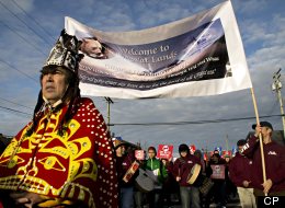 Leaders of the Gitga'at First Nation, from Hartley Bay, BC, lead a protest march at the No to Tankers rally, at Prince Rupert, BC, Feb. 4, 2012. The equity offer from Northern Gateway to aboriginal groups along the route of a controversial oil pipeline would amount to an average of about $70,000 a year for the bands, which would be obliged to borrow the millions of dollars needed to purchase equity from Calgary-based Enbridge itself. (The Canadian Press Images/Robin Rowland)