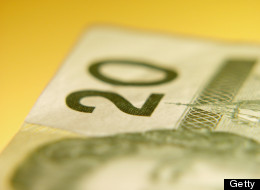 The loonie slid to its lowest level in nearly two years Tuesday morning as the U.S. dollar gained traction on confidence over the direction of bond yields. (Getty Images)