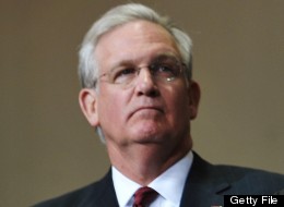 US President Barack Obama (C) with Missouri Governor Jay Nixon (L) and Superintendent C.J. Huff (R) listen to then national anthem during the Joplin High School Commencement Ceremony May 21, 2012 at Missouri Southern State University in Joplin, Missouri. AFP PHOTO/Mandel NGAN (Photo credit should read MANDEL NGAN/AFP/GettyImages)