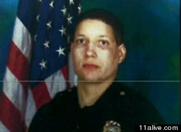 Authorities say Crystal Parker, a suburban Atlanta police officer who was found dead in her house, was killed by a gunshot wound to her head.