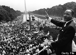Martin Luther KIng (C) waves to supporters on August 28, 1963 on the Mall in Washington DC (Washington Monument in background) during the 'March on Washington'. (AFP/Getty Images)