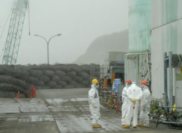 Workers take a break at the Tokyo Electric Power Co. (Tepco) Fukushima Dai-Ichi nuclear power plant in Okuma, Fukushima Prefecture, Japan, on Wednesday, June 12, 2013. The Tepco Fukushima Dai-Ichi plant reactor core meltdowns, which occurred after the plant was hit by an earthquake and tsunami on March 11, 2011, forced about 160,000 people to evacuate and left about 132 square kilometers as a no-go zone, some of it uninhabitable for decades. Photographer: Toshifumi Kitamura/Pool via Bloomberg
