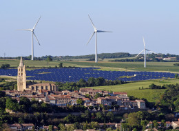 Wind turbines and a solar park are pictured on May 26, 2013 near the village of Avignonet-Lauragais, located southeast of Toulouse in the Midi-Pyrenees region. (REMY GABALDA/AFP/Getty Images)
