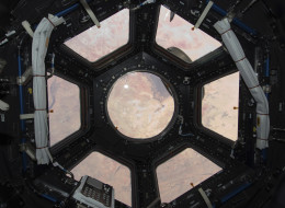Sahara Desert visible through the windows of the cupola on the ISS Tranquility module