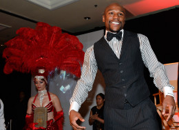 Floyd Mayweather Jr. walks on stage to accept the award for Male Fighter of the Year from Nevada at the Nevada Boxing Hall of Fame inaugural induction gala at the Monte Carlo Resort and Casino on August 10, 2013 in Las Vegas, Nevada.