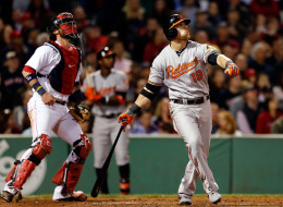 Chris Davis #19 of the Baltimore Orioles hits a home run in the 6th inning against the Boston Red Sox at Fenway Park on September 17 in Boston, Massachusetts. (Photo by Jim Rogash/Getty Images)