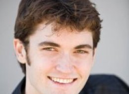 A U.S. website operator lived a double life, portraying himself as an Internet trailblazer while leading a massive online drug empire and trying to arrange the killings in British Columbia of five people that he thought were interfering in his business, a prosecutor said Thursday.
