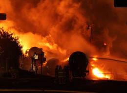 Rail cars on fire in Lax-Megantic, Que., July 5, 2013. An expert who examined the devastating train derailment in Lac-Megantic says no plans and equipment are in place to deal with a similar situation as the one-year anniversary of the tragedy approaches.