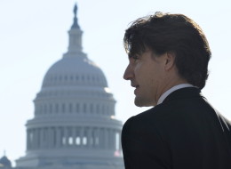 With the Capitol dome in the background, Canadian Liberal Leader Justin Trudeau speaks to reporters during his first official visit to Washington since becoming Liberal Leader on Oct. 25, in Washington. (AP Photo/Susan Walsh)