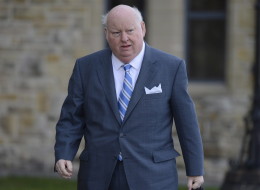 Sen. Mike Duffy arrives to the Senate on Parliament Hill in Ottawa on Oct. 28. (THE CANADIAN PRESS/Adrian Wyld)