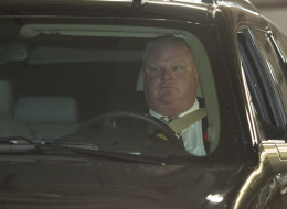 TORONTO, ON - NOVEMBER 5: Toronto Mayor Rob Ford drives out of the underground parking with an office assistant in the car with him on November 5, 2013. Ford had earlier addressed the media following this morning's admission of having smoked crack. Ford did not step down, and said the city business must go on. (Rick Madonik/Toronto Star via Getty Images)