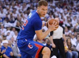 Blake Griffin #32 of the Los Angeles Clippers is called for a charge on Draymond Green #23 of the Golden State Warriors during the first quarter at ORACLE Arena on December 25, 2013 in Oakland, California. NOTE TO USER: User expressly acknowledges and agrees that, by downloading and or using this photograph, User is consenting to the terms and conditions of the Getty Images License Agreement. (Photo by Thearon W. Henderson/Getty Images)