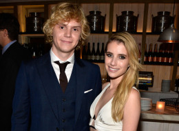 Emma Roberts is reportedly engaged to marry Evan Peters. Here, they attend the Premiere Of FX's 'American Horror Story: Coven' after party at Fig & Olive Melrose Place on Oct. 5 in West Hollywood. (Frazer Harrison/Getty Images)