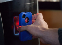 VANCOUVER, BC - OCTOBER 29: A user scans a QR code on their smart phone, allowing bitcoins to be transferred into their digital wallet, while using the world's first bitcoin ATM at Waves Coffee House on October 29, 2013 in Vancouver, British Columbia, Canada. The ATM, named Robocoin, allows users to buy or sell the digital currency known as bitcoins. Once only used for black market sales on the internet, bitcoins are starting to be accepted at a growing number of businesses. (Photo by David Ryd