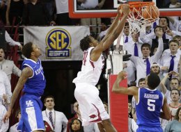 Arkansas' Michael Qualls jams in the game-winner as the Razorbacks defeated Kentucky, 87-85, in overtime in Fayetteville, Ark., on Tuesday Jan. 14, 2014.