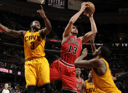 Joakim Noah #13 of the Chicago Bulls pulls down the rebound against Dion Waiters #3 and Tristan Thompson #13 of the Cleveland Cavaliers at The Quicken Loans Arena on January 22, 2014 in Cleveland, Ohio. (Photo by David Liam Kyle/NBAE via Getty Images)