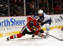 Chicago Blackhawks' Brandon Bollig shoots and scores against Winnipeg Jets goalie Al Montoya in the 1st period at the United Center in Chicago on Sunday, Jan. 26, 2014. (Scott Strazzante/Chicago Tribune/MCT via Getty Images)