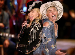 HOLLYWOOD, CA - JANUARY 28: Madonna and Miley Cyrus perform onstage during Miley Cyrus: MTV Unplugged at Sunset Gower Studios on January 28, 2014 in Hollywood, California. Miley Cyrus: MTV Unplugged premieres on January 29, 2014 on MTV at 9/8 PM. (Photo by Christopher Polk/Getty Images for MTV)