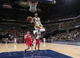 Paul George #24 of the Indiana Pacers throws down the 360-dunk against the Los Angeles Clippers at Bankers Life Fieldhouse on January 18, 2014 in Indianapolis, Indiana. NOTE TO USER: User expressly acknowledges and agrees that, by downloading and or using this Photograph, user is consenting to the terms and condition of the Getty Images License Agreement. Mandatory Copyright Notice: 2014 NBAE (Photo by Gregory Shamus/NBAE via Getty Images)