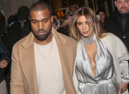 Kanye West has denied claims he cheated on Kim Kardashian. Here, the two leave the 'Meurice' hotel on Jan. 21 in Paris. (Marc Piasecki/FilmMagic)