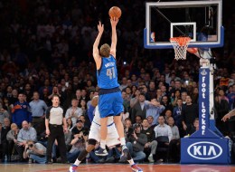 Dirk Nowitzki of the Dallas Mavericks shoots the winning shot over Carmelo Anthony of the New York Knicks during their NBA game February 24, 2014 at Madison Square Garden in New York. The Mavericks won, 110-108. AFP PHOTO/Stan HONDA (Photo credit should read STAN HONDA/AFP/Getty Images)