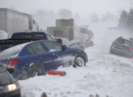 Damaged vehicles are shown after a multi-vehicle pileup on Highway 400 near Innisfil, Ont., Thursday, Feb.27, 2014.