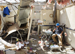 VILONIA, ARKANSAS - APRIL 28: Victor Umbright of Vilonia Direct TV, sits in what is left of his office after a tornado yesterday tore through the area for the second time in three years, on April 28, 2014 in Vilonia, Arkansas. (Photo by Wesley Hitt/Getty Images)