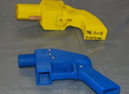 Seized plastic made guns produced by a 3-D printer are displayed at a police station in Yokohama on May 8, 2014. A Japanese man suspected of possessing guns made with a 3-D printer has been arrested in what was said to be the country's first such detention. Officers who raided the home of Yoshitomo Imura, a 27-year-old college employee, confiscated five weapons, two of which had the potential to fire lethal bullets. AFP PHOTO / JIJI PRESS JAPAN OUT (Photo credit should read JIJI PRE