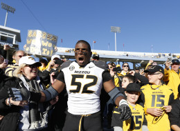 Michael Sam #52 of the Missouri Tigers celebrates with fans after the game against the Kentucky Wildcats at Commonwealth Stadium on November 9, 2013 in Lexington, Kentucky. Missouri won 48-17. (Photo by Joe Robbins/Getty Images)