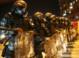 RIO DE JANEIRO, BRAZIL - JUNE 15: Military Police block anti-World Cup protestors attempting to march to Maracana stadium on June 15, 2014 in Rio de Janeiro, Brazil. Today is the fourth day of the 2014 FIFA World Cup. (Photo by Mario Tama/Getty Images)