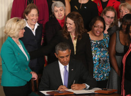 President Barack Obama, signing an executive order in April enforcing equal pay for federal contractors with Lilly Ledbetter on his left, has not done significantly better in hiring women in his own administration. (Mark Wilson/Getty Images)