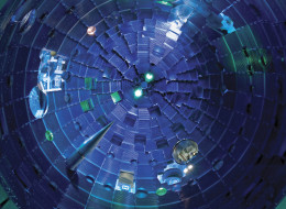 NIF Target Chamber This view from the bottom of the chamber shows the target positioner being inserted. Pulses from NIF's high-powered lasers race toward the Target Bay at the speed of light. They arrive at the center of the target chamber within a few trillionths of a second of each other, aligned to the accuracy of the diameter of a human hair.