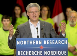 Canadian Prime Minister Stephen Harper responds to questions after making an announcement at the Yukon college in Whitehorse, Thursday August 21, 2014. (THE CANADIAN PRESS/Adrian Wyld)