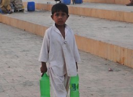 A Pakistani child sells beverages on a beach in Karachi on March 21, 2012 on the eve of the UN World Water Day.