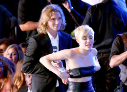 INGLEWOOD, CA - AUGUST 24: My Friend's Place representative Jesse (L) accepts Video of the Year with singer Miley Cyrus for 'Wrecking Ball' onstage during the 2014 MTV Video Music Awards at The Forum on August 24, 2014 in Inglewood, California. (Photo by Mark Davis/Getty Images)