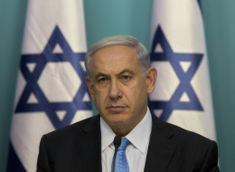 Israeli Prime Minister Benjamin Netanyahu sits during a press conference at the prime minister's office in Jerusalem, Wednesday, Aug. 27, 2014. (AP Photo/Sebastian Scheiner)