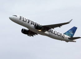 The Frontier Airlines plane that Amber Vinson flew from Cleveland to Dallas on Monday, flies out of Cleveland Hopkins International Airport Wednesday, Oct. 15, 2014, in Cleveland. Vinson is the second nurse to be diagnosed with Ebola at the Texas Health Presbyterian Hospital in Dallas. Ohio health officials aren't sure how many people came into contact with Vinson as she visited family in the Akron area days before being diagnosed with the disease. (AP Photo/Tony Dejak)