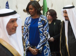 Saudi new King Salman (R), and US First Lady Michelle Obama (C) hold a receiving line for delegation members at the Erga Palace in the capital Riyadh on January 27, 2015. US President Barack Obama is in Saudi Arabia to shore up ties with new King Salman and offer condolences after the death of his predecessor Abdullah. AFP PHOTO / SAUL LOEB        (Photo credit should read SAUL LOEB/AFP/Getty Images)
