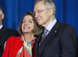 Senate Majority Leader Harry Reid of Nev., right, hugs House Speaker Nancy Pelosi of Calif., during a signing ceremony for 
