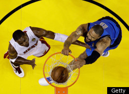 MIAMI, FL - JUNE 12: Tyson Chandler #6 of the Dallas Mavericks dunks against Chris Bosh #1 of the Miami Heat in Game Six of the 2011 NBA Finals at American Airlines Arena on June 12, 2011 in Miami, Florida. NOTE TO USER: User expressly acknowledges and agrees that, by downloading and/or using this Photograph, user is consenting to the terms and conditions of the Getty Images License Agreement. (Photo by David J. Phillip-Pool/Getty Images)