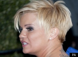 Kerry Katona fights off unwanted attention from female stalker