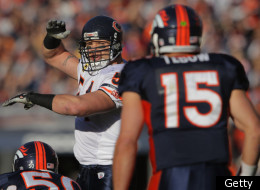 DENVER, CO - DECEMBER 11: Linebacker Brian Urlacher #54 of the Chicago Bears runs the defense against quarterback Tim Tebow #15 of the Denver Broncos at Sports Authority Field at Mile High on December 11, 2011 in Denver, Colorado. The Broncos defeated the Bears 13-10 in overtime. (Photo by Doug Pensinger/Getty Images)